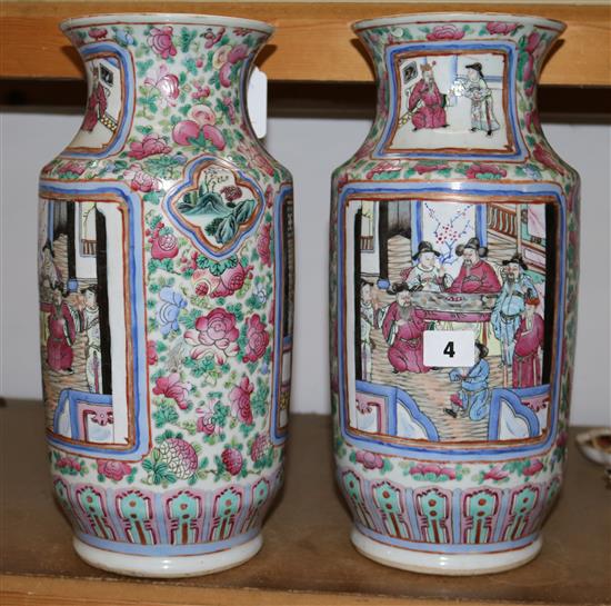 A pair of Chinese-Canton decorated famille rose cylindrical vases, mid 19th century, height 35.5cm, some damage